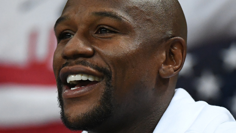 Floyd Mayweather smiling at red carpet event