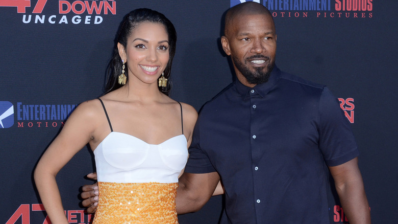 Jamie and Corinne Foxx pose 