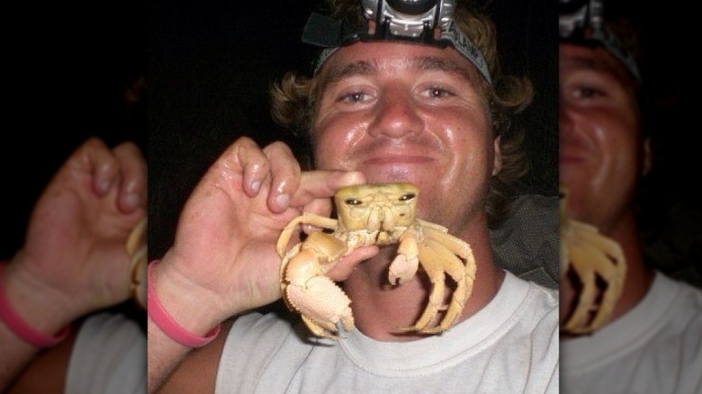 Blaine Lawrence holding a crab