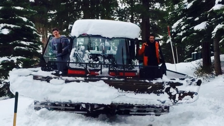 Jeremy Renner riding snowcat