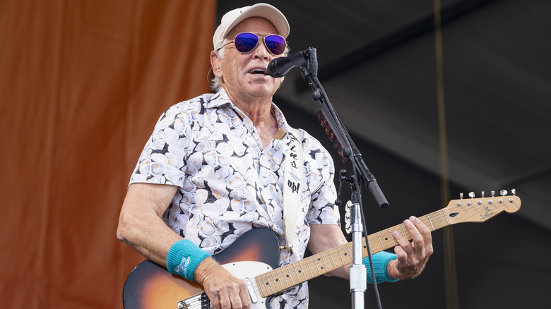 Jimmy Buffett playing guitar