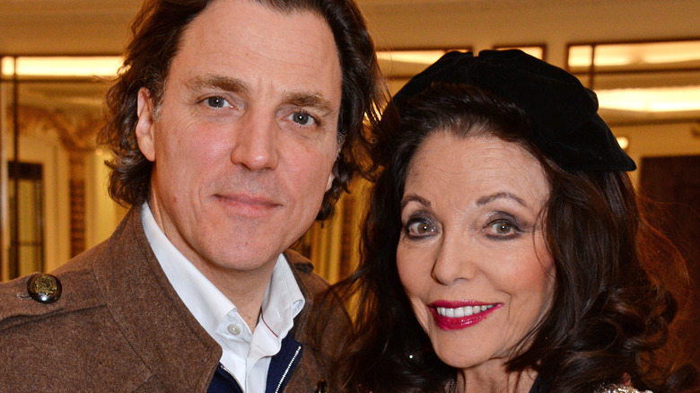 Alexander Newley and Dame Joan Collins posing