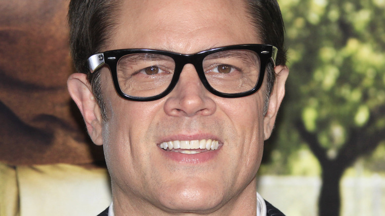 Johnny Knoxville black rimmed glasses smiling