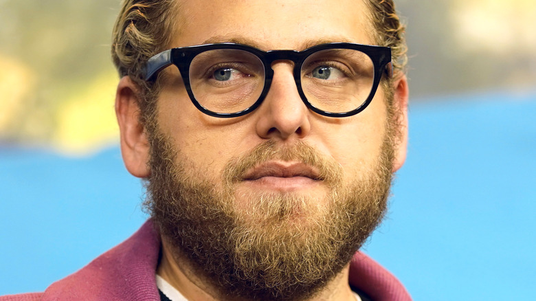 Jonah Hill stares into the crowd at an event