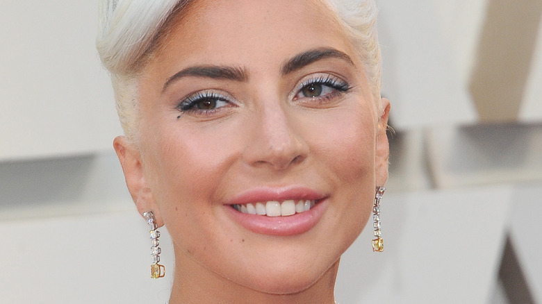 Lady Gaga smiling on the red carpet