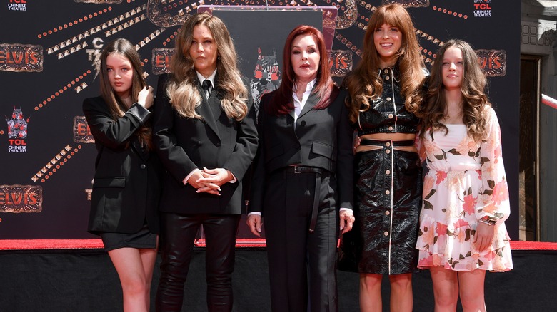 Lisa Marie Presley posing with her mother and daughters