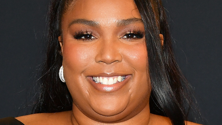 Lizzo smiling on the red carpet