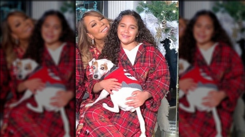 Monroe Cannon wearing pajamas on Mariah Carey's lap
