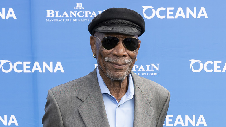 Morgan Freeman smiles in sunglasses