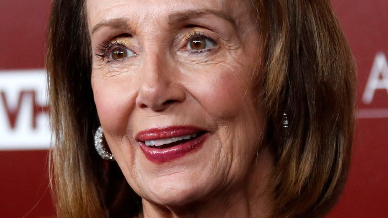 Nancy Pelosi smiles