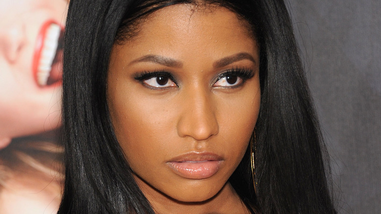 Nicki Minaj with serious expression on the red carpet