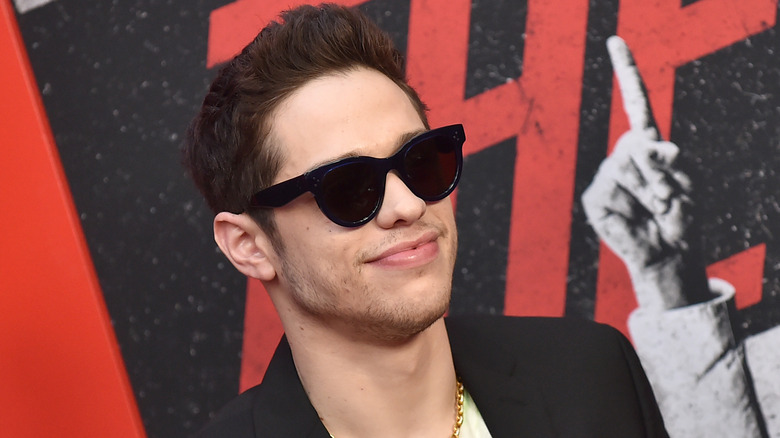 Pete Davidson posing in sunglasses