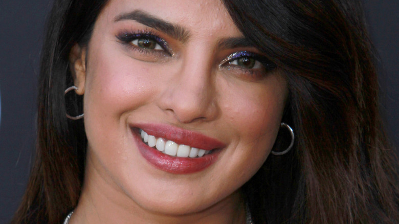 Priyanka Chopra smiles in small hoop earrings