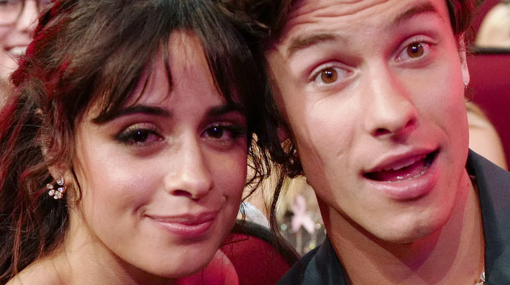 Shawn Mendes and Camila Cabello smiling at an event