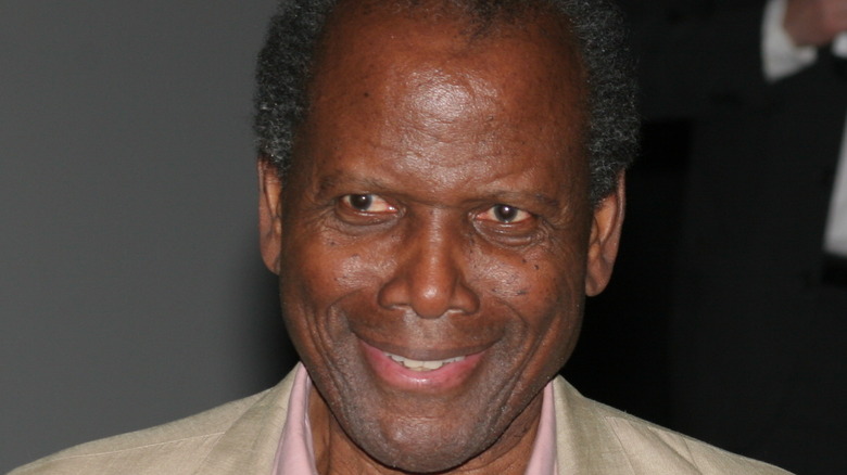 Sidney Poitier smiles at an outing