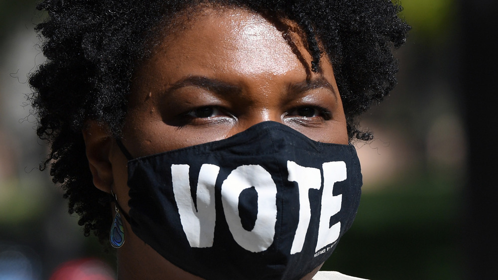 Stacey Abrams wearing a vote face mask