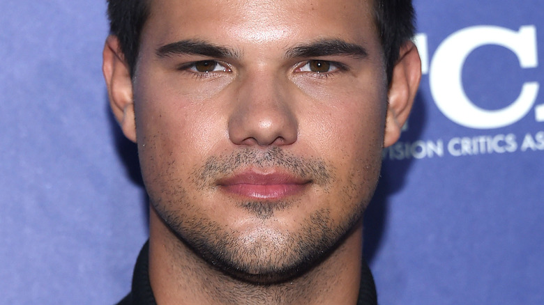 Taylor Lautner smirking