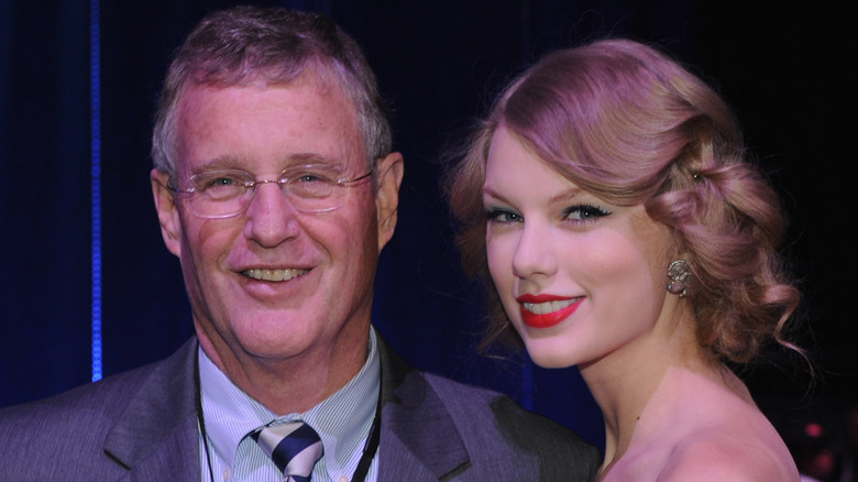 Scott Swift and Taylor Swift posing for a photo