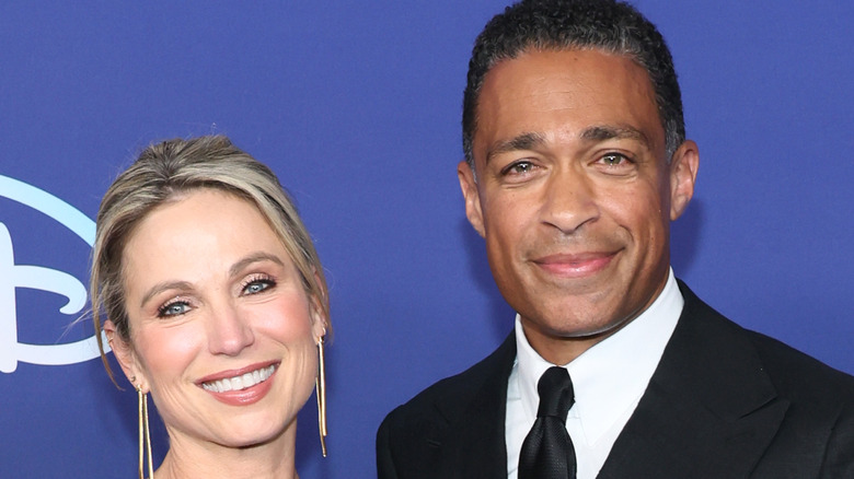 Amy Robach and T.J. Holmes posing together