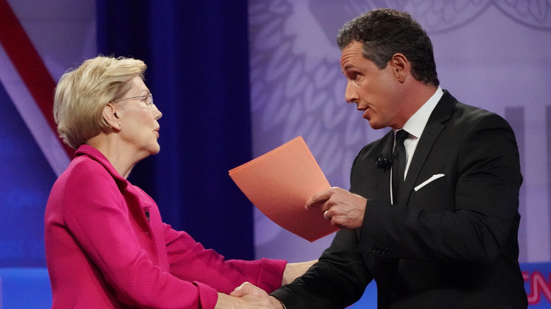  Sen. Elizabeth Warren (D-MA) shakes hands with CNN moderator Chris Cuomo at CNN's presidential town hall focused on LGBTQ issues in 2019 