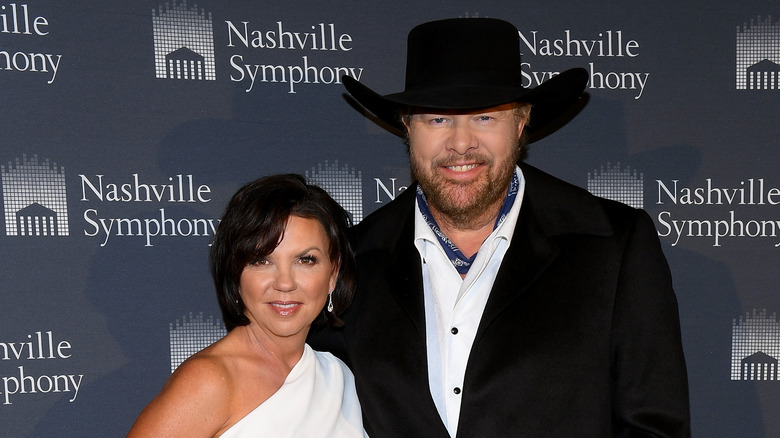 Tricia Lucas posing with Toby Keith