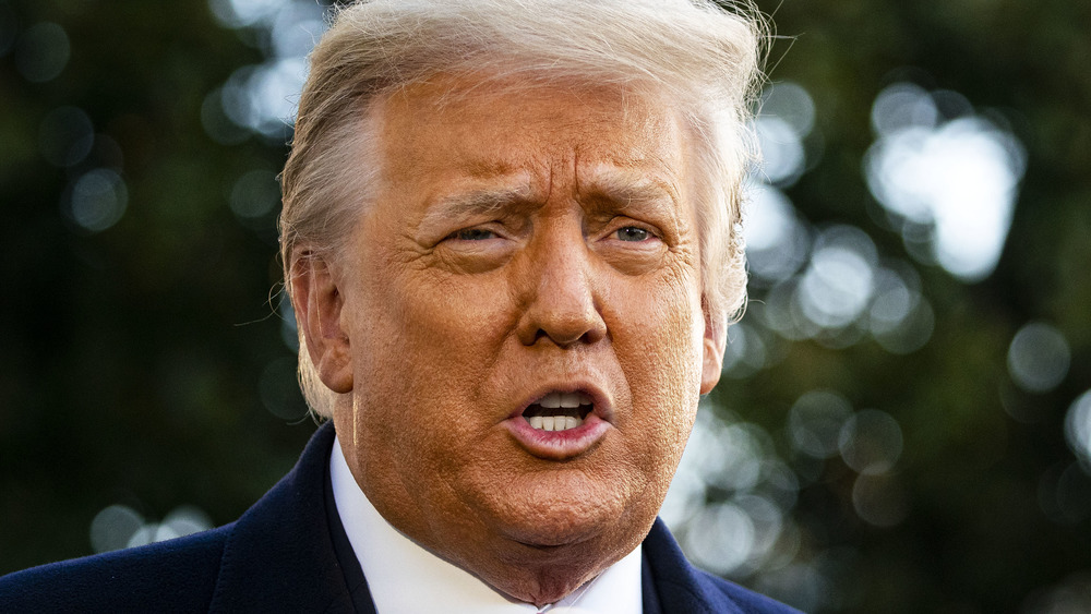 Donald Trump speaks to members of the media before boarding Marine One on the South Lawn of the White House in Washington, D.C., U.S., on Wednesday, Jan. 20, 2021.