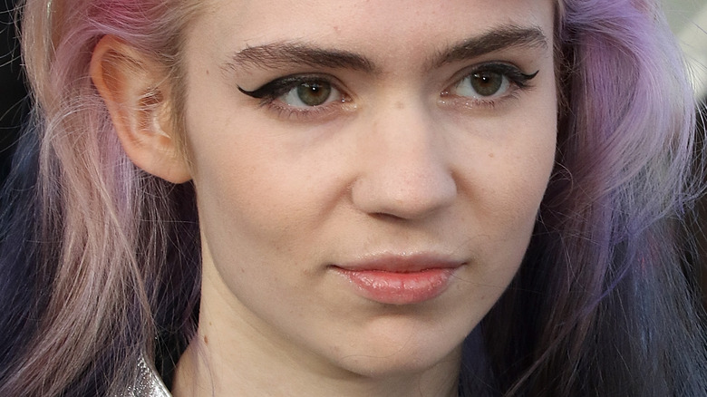 Grimes with a serious expression