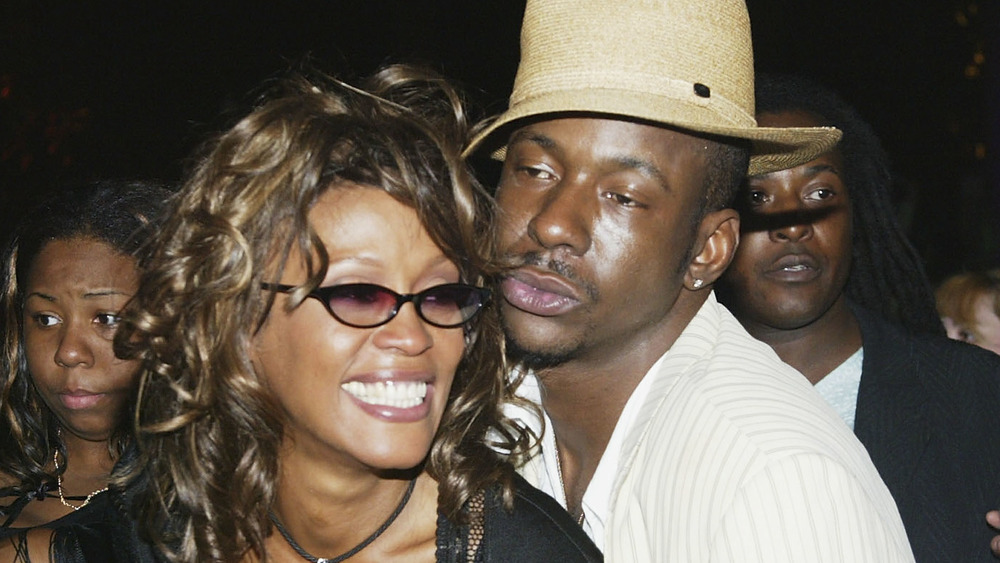 Whitney Houston and Bobby Brown embracing