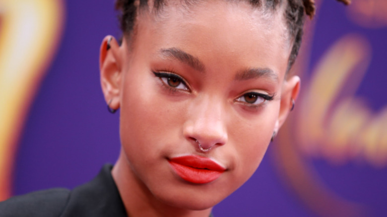 Willow Smith poses in red lipstick.