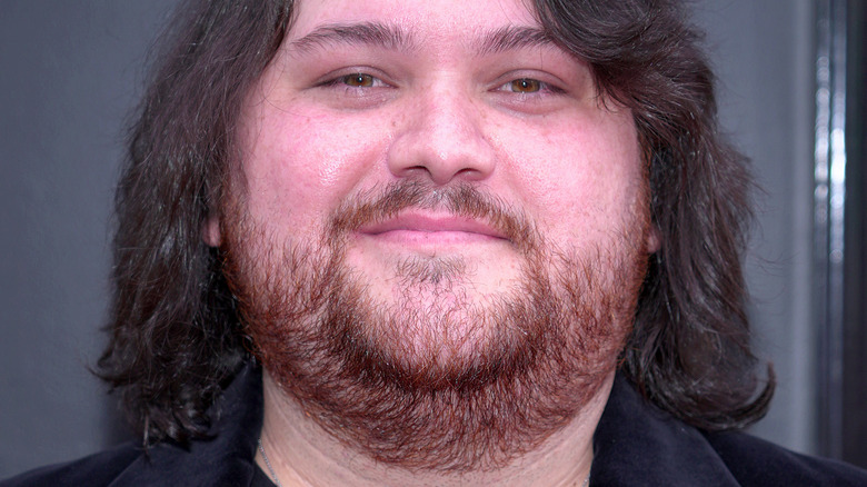 Wolfgang Van Halen smirking