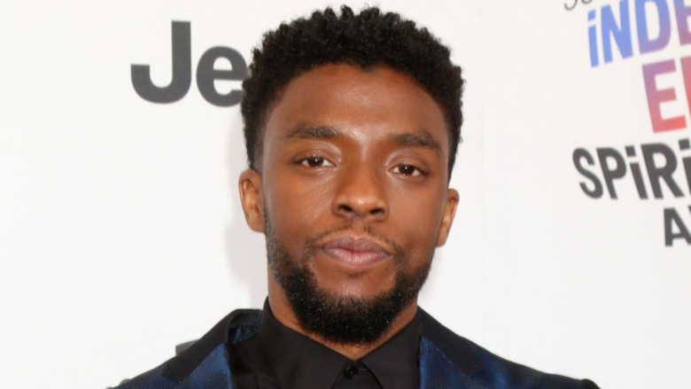 Chadwick Boseman with a serious expression