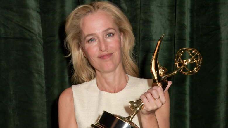Gillian Anderson holding an Emmy Award