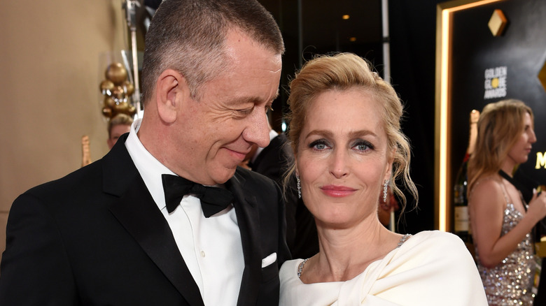 Gillian Anderson and date smiling