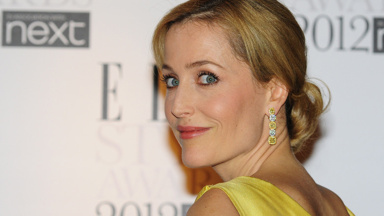 Gillian Anderson in profile while wearing long earrings
