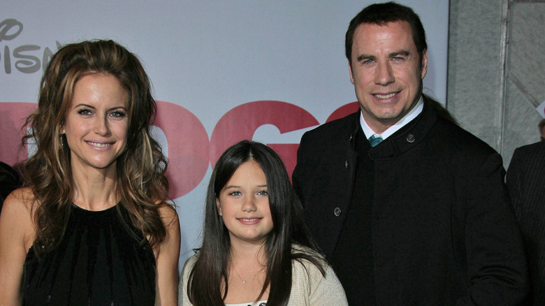 Kelly Preston, Ella Travolta, and John Travolta on the red carpet