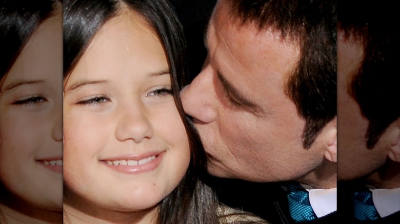John Travolta kissing Ella Travolta on the cheek
