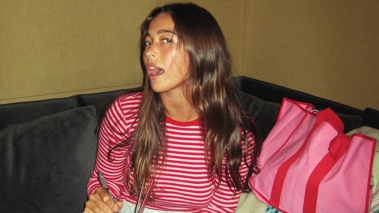 Lola Consuelos posing for cameras while writing song