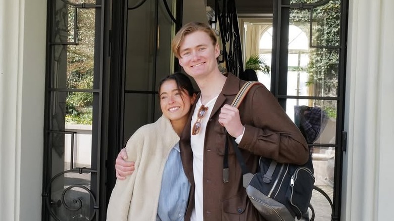 Lola Consuelos and Cassius Kidston posing for cameras outside home