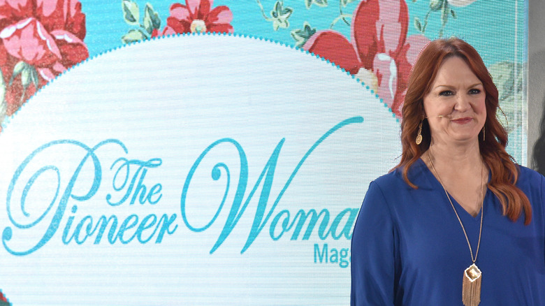 Ree Drummond poses by magazine logo