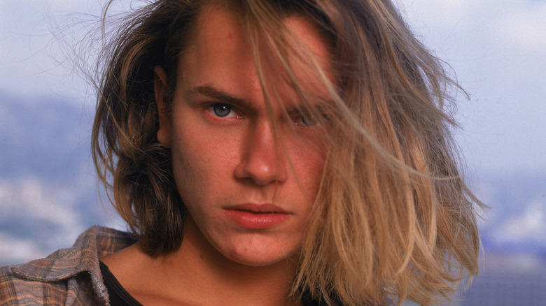 River Phoenix looking at camera