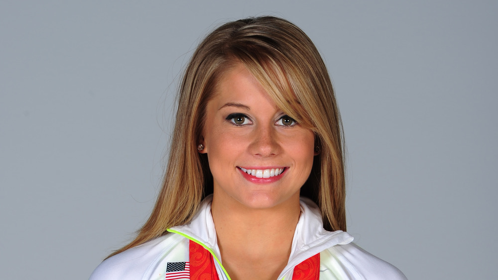 Shawn Johnson at a photoshoot with her medals