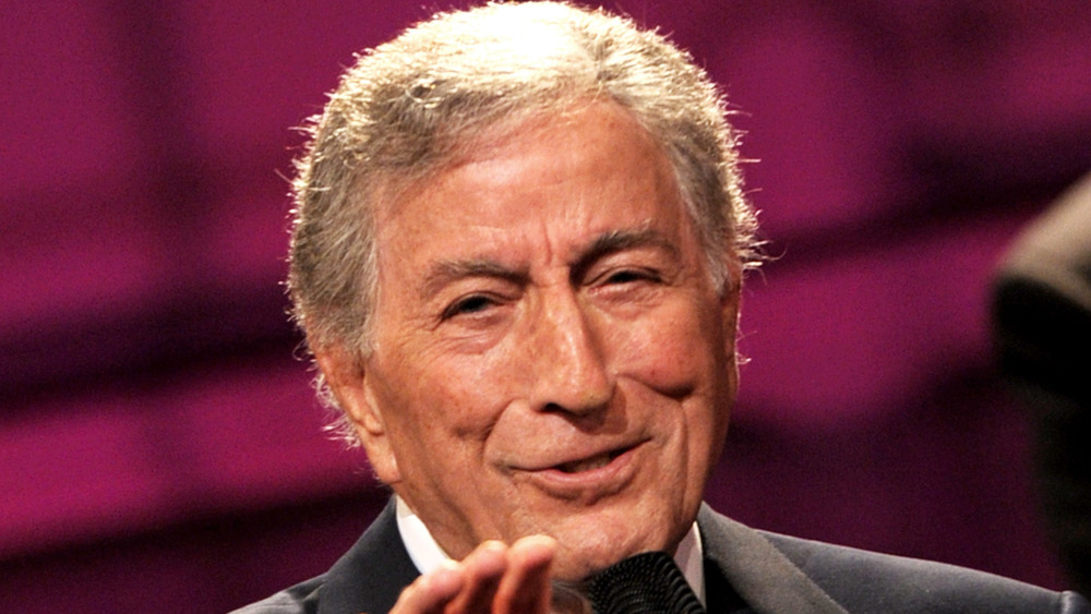 Tony Bennett reaching out while singing