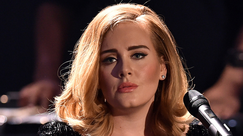 Adele in front of a mic
