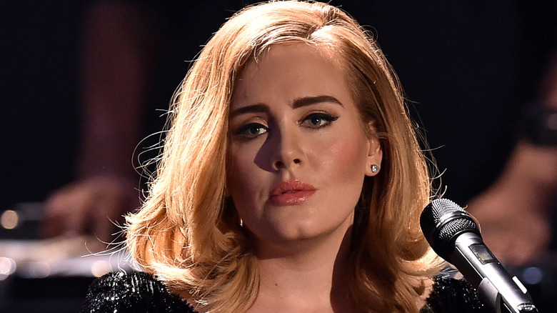 Adele in front of a mic