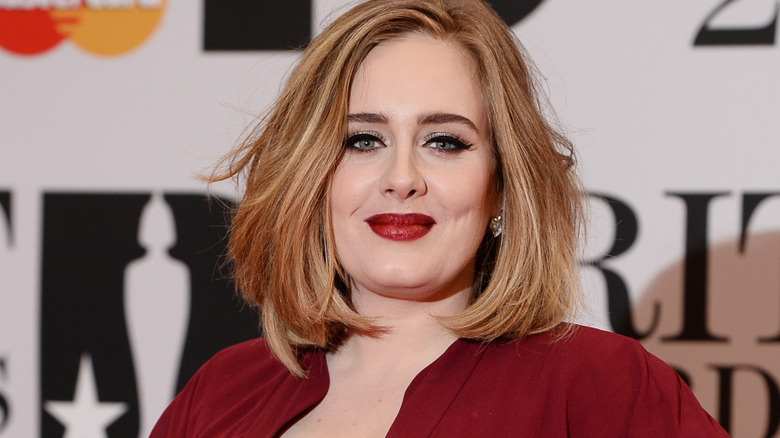 Adele in a red dress