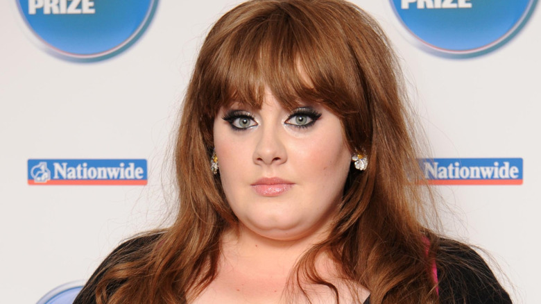 Adele holding an award