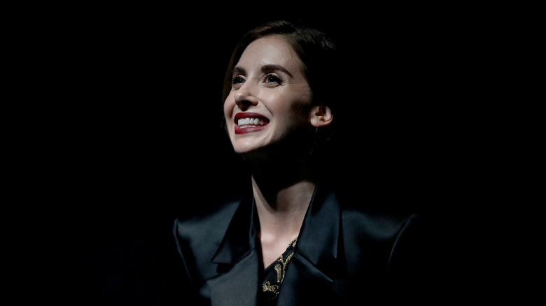 Alison Brie smiling low light