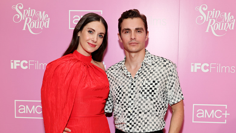 Alison Brie smiling with Dave Franco