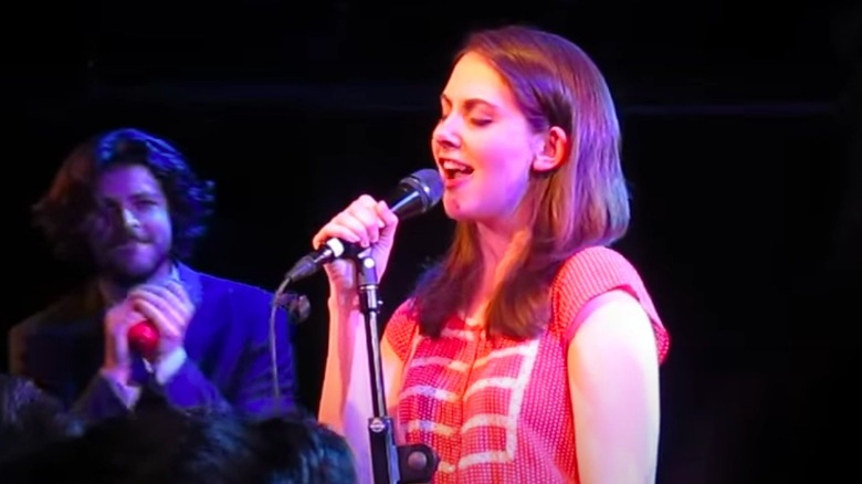Alison Brie singing on stage