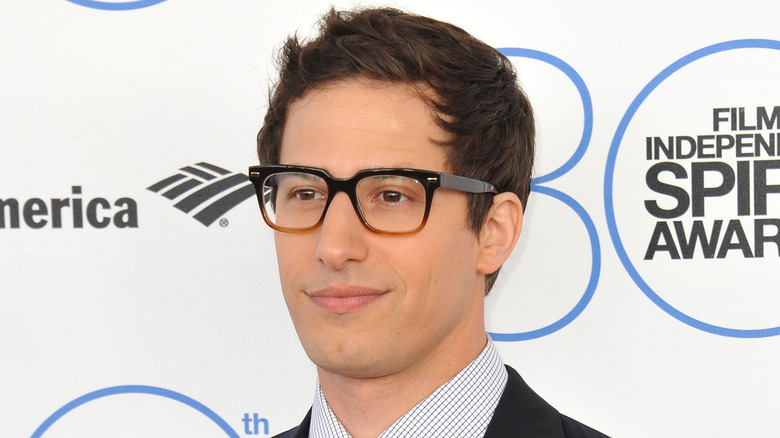 Andy Samberg slightly smiling